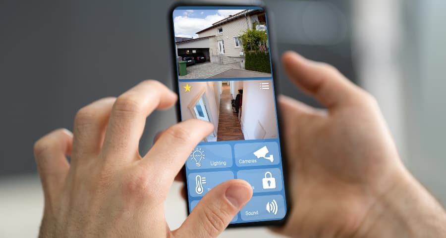 Resident examining video camera footage on a cell phone