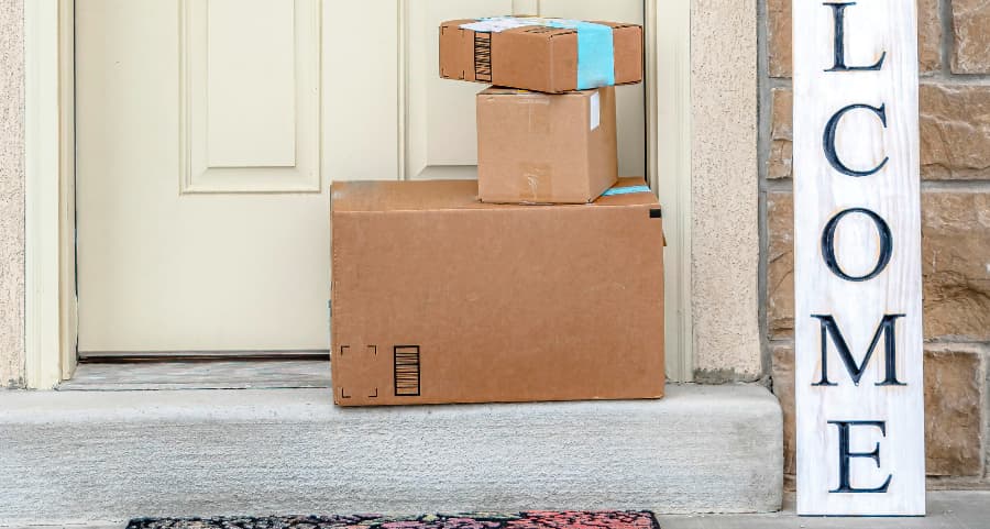 Deliveries on the front porch of a house with a welcome sign in West Palm Beach
